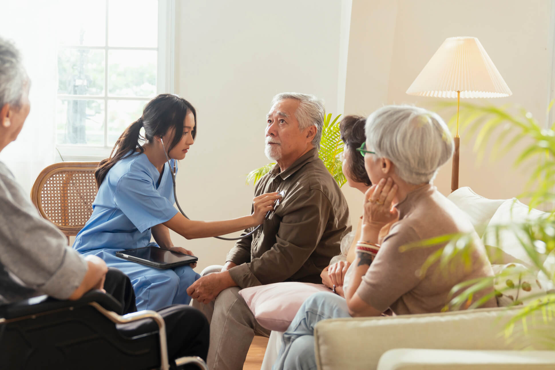 Home health nurse caring for patients